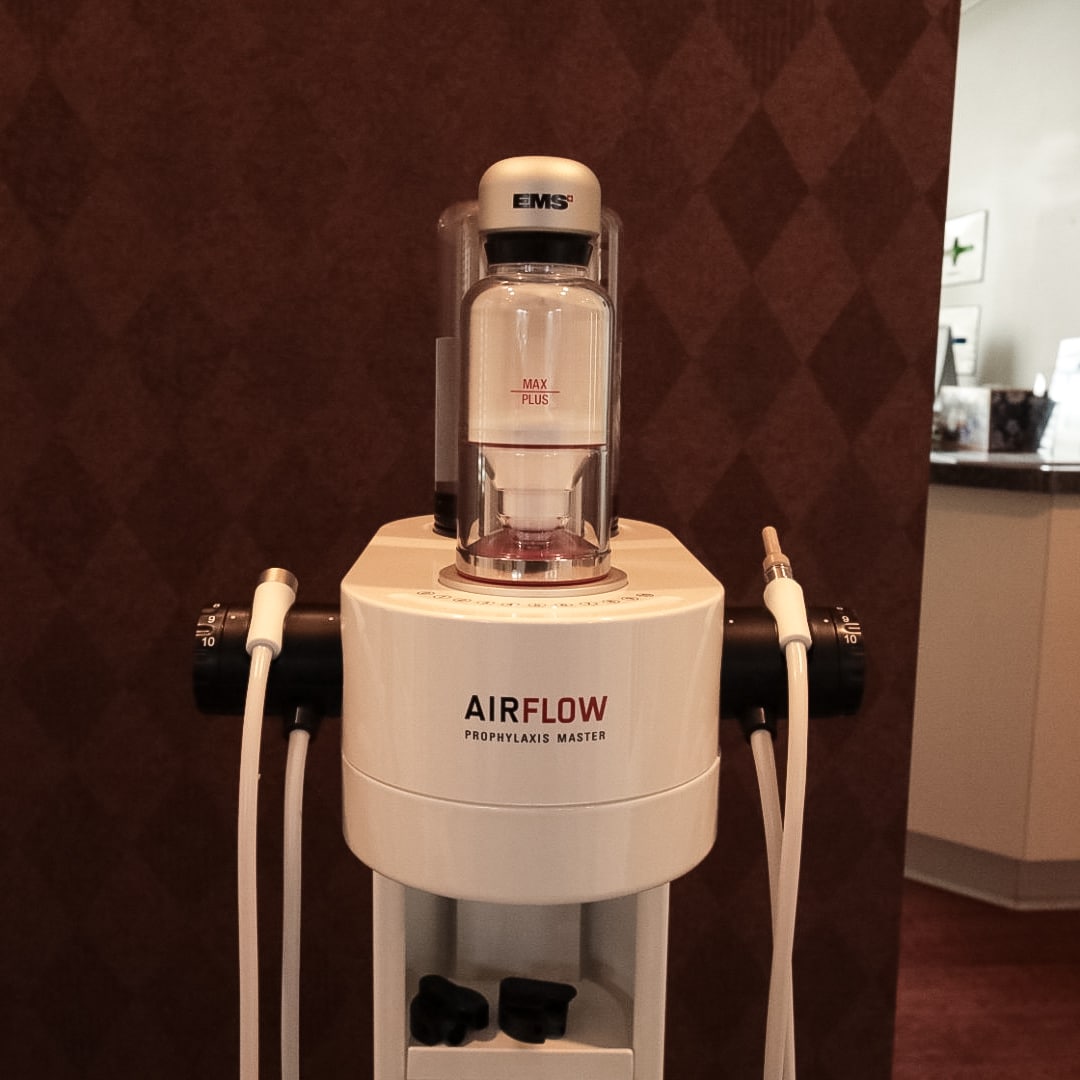 Close-up of the EMS AIRFLOW Prophylaxis Master unit used for gentle cleanings